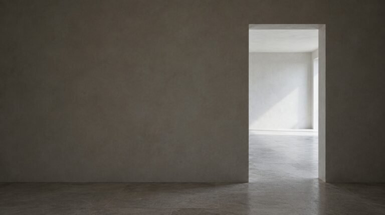 A doorway ajar from a dark hall, light on plain tiles